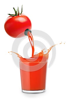 Juice pours from tomato into glass