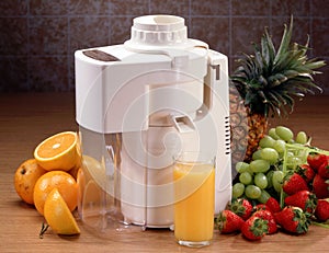 Juicer with glass and fruit