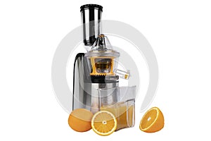 Juicer isolated on a white background. Modern stainless steel fruit and juice machine with orange an juice. Electric fruit and veg