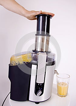 Juicer making orange juice