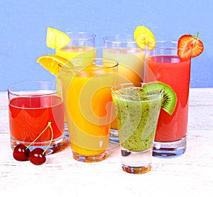 Juices from cherry, orange, strawberry, kiwi and banana