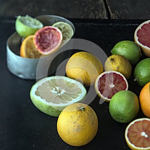 Juicing a selection of fresh citrus fruit photo