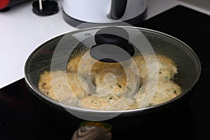 juicy appetizing homemade cutlets frying in a frying pan in the kitchen 2