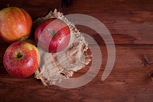 Juicy apples on a wood desk