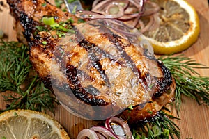 Juicy barbecue pork ribs beer, snacks lie on a wooden tray.