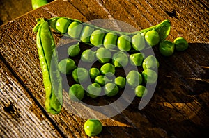 Juicy beans. ripe green peas on wooden boards