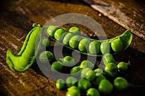 Juicy beans. ripe green peas on wooden boards