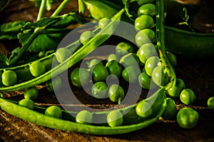 Juicy beans. ripe green peas on wooden boards