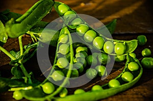 Juicy beans. ripe green peas on wooden boards