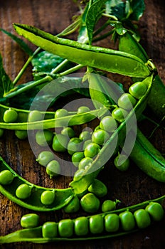 Juicy beans. ripe green peas on wooden boards