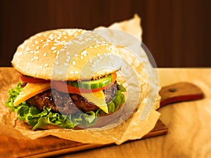 Juicy Burger on a wooden Board