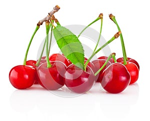 Juicy cherry with leaf isolated on white background