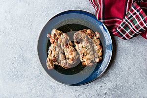 Juicy Chicken Thighs with Sauce of Thyme, Onion and Dried Tomatoes.