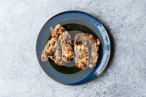 Juicy Chicken Thighs with Sauce of Thyme, Onion and Dried Tomatoes.