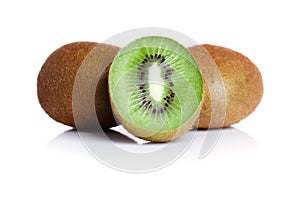 Juicy cut in a half kiwi fruit and whole kiwis fruit, on a white background. Close-up of kiwi fruit with a thin