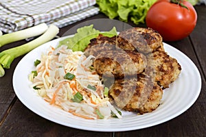 Juicy cutlets and salad with fresh vegetables