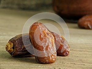 Juicy dates on a old wooden table. Copy space, selective focus