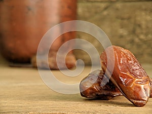 Juicy dates on a old wooden table. Copy space, selective focus