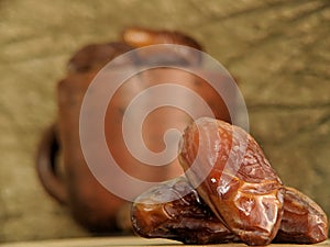 Juicy dates on a old wooden table. Copy space, selective focus