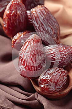 Juicy dates on the table with satin