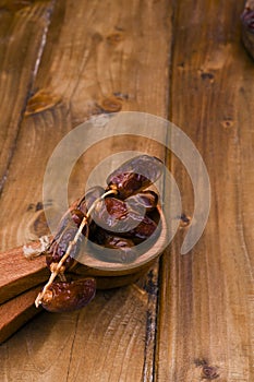 Juicy dates on a wooden table. Dried fruits for a healthy diet.