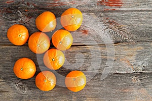 Juicy fresh clementines on a rustic wooden table