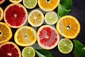 Juicy fruit background from various slices of citrus