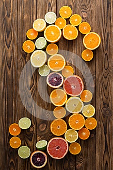 Juicy healthy halved citrus fruit in an S-shape