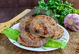 Juicy homemade cutlets on a wooden backgro