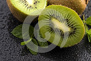 Juicy kiwi fruit and freas mint leaves