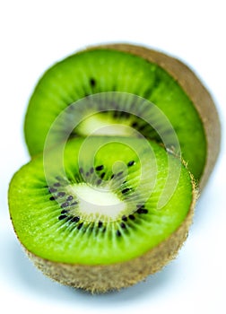 Juicy kiwi fruit sliced on white. Selective focus.