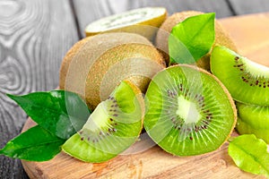 Juicy kiwi fruit on wooden table. High quality photo