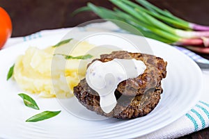 Juicy liver cutlet with sauce and mashed potatoes