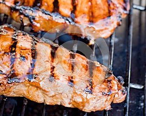 Juicy New York strip steak on a grill