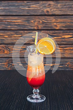 Juicy Orange and Red Tequila Sunrise. Sex on the beach cocktail in glass. Summer fresh cocktail with grenadine