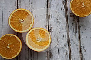 Juicy oranges on a white wooden table, orange texture, vitamins, citruses, textured background of the table
