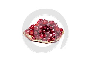 Juicy pieces of bright red cut pomegranate isolated on white background.