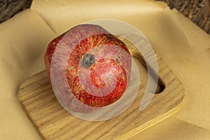 juicy pomegranate on a wooden board