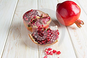 Juicy pomegranates on wood