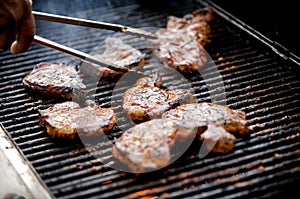 Juicy pork chops on a grill