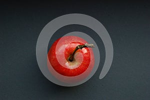 Juicy red apple on a dark background