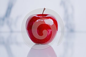 Juicy red apple with reflection photo