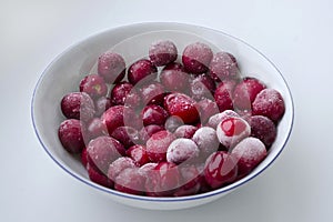 Juicy red cherries on a bright white background