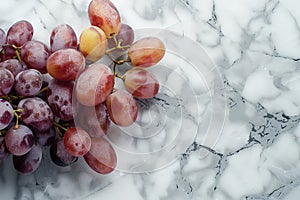 Juicy red grapes on a marble background