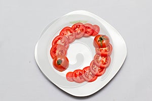 Juicy red tomatoes in table cloth . caro background photo