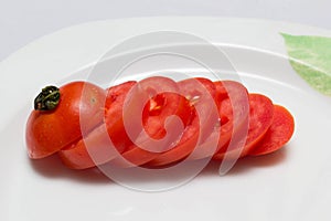 Juicy red tomatoes in table cloth . caro background photo