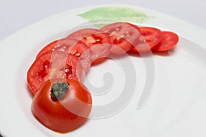 Juicy red tomatoes in table cloth . caro background photo