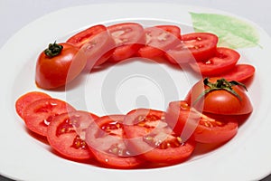 Juicy red tomatoes in table cloth . caro background photo