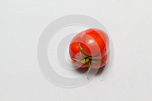 Juicy red tomatoes in table cloth . caro background photo