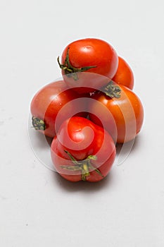 Juicy red tomatoes in table cloth . caro background photo